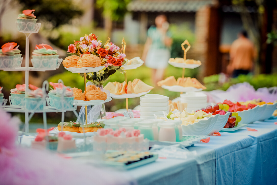 Various Desserts on a Table covered with Baby Blue Cover